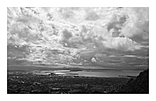 photo of the view on San Francisco with dramatic clouds above in black and white